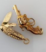 A 9ct gold pistol pendant or charm and penknife, both hallmarked, 38mm, 28mm, 12.6g