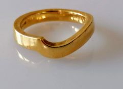 A freeform contemporary yellow gold wedding band, 3.3mm wide, size J, hallmarked 18ct, 4.67g with