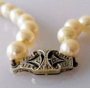 An Art Deco single row of fifty-one graduated cultured pearls measuring approx. 7.96mm to 10.35mm