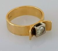 A 1970's yellow gold artisan solitaire ring with a round brilliant-cut diamond, approximately 0.32