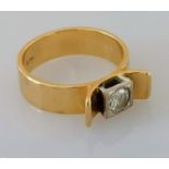 A 1970's yellow gold artisan solitaire ring with a round brilliant-cut diamond, approximately 0.32