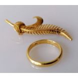 A yellow gold fern brooch with etched decoration, 50mm and a wedding band, size O, 3mm, both