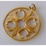 A 9ct yellow gold carved pendant, 36mm diameter, hallmarked, 8.12g