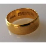 A 22ct yellow gold wedding band, size K 1/2, 7mm, hallmarked, 5.82g