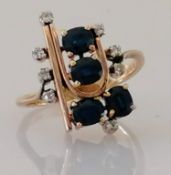 A mid-century sapphire and diamond cocktail ring on a white and yellow gold setting, size N, stamped