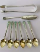 A set of six George V silver coffee spoons with blue enamel decoration by Levi & Salaman,