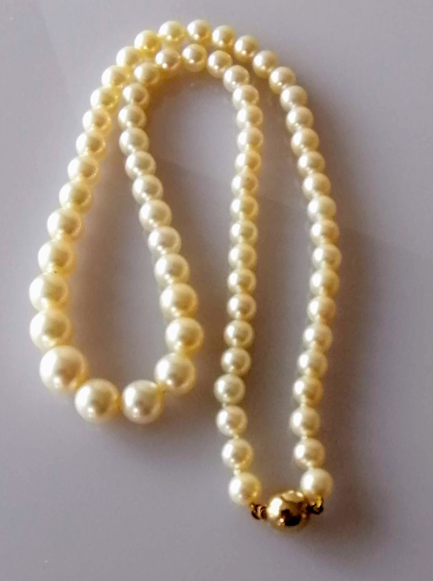 A mid-century single row of sixty-nine graduated Akoya cultured pearls measuring 6mm to 9.7mm with - Image 2 of 3
