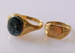 Two 9ct yellow gold signet rings, one with a carved oval onyx, the other initialled, sizes S, H,