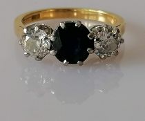 A three-stone sapphire and diamond ring on 18ct yellow gold and platinum, brilliant-cut sapphire