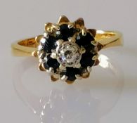 A 18ct gold diamond and sapphire flower ring, size I, hallmarked, 3.55g