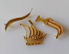 Two yellow gold brooches, one of a fern, 45mm, stamped 750, 2.17g, the other of a dagger and