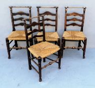 A harlequin set of four early 19th century ash and elm Macclesfield dining chairs with ladder backs,