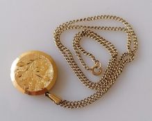 A 9ct yellow gold locket with etched floral decoration and chain, hallmarked, 48 cm, 12.3g