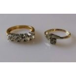 A five-stone pave-set cubic zirconia and gold ring with round brilliant-cut stones, size N,