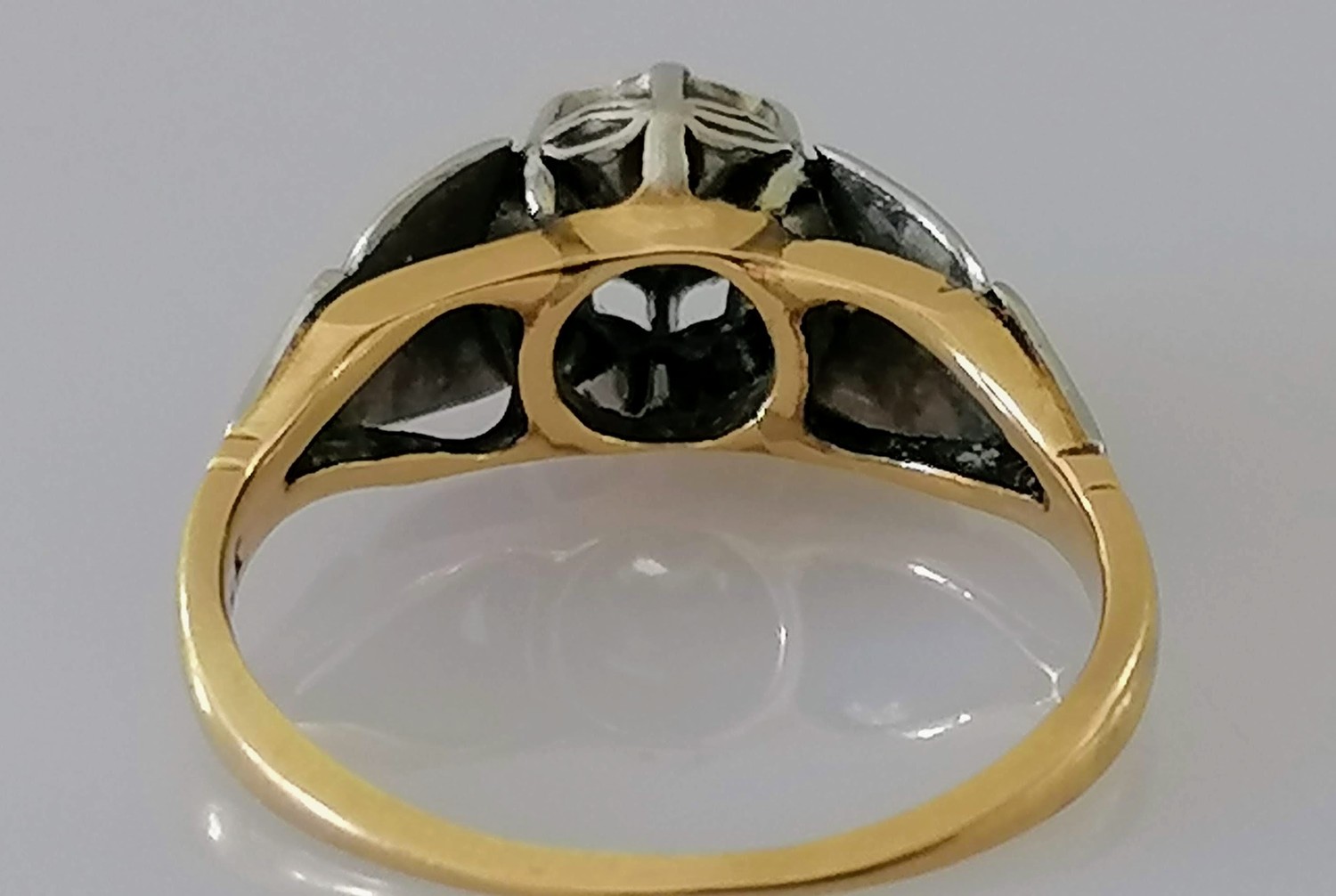 An Art Deco-style gold and platinum solitaire ring with stylized shoulders, the round-cut diamond in - Image 4 of 4