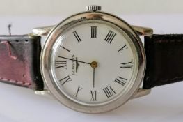 A vintage Longines manual gent's watch with Roman numerals in a stainless steel case, 33mm, and