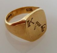 A 9ct yellow gold signet ring, initialled, size T, hallmarked, 10.9g