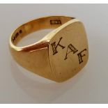 A 9ct yellow gold signet ring, initialled, size T, hallmarked, 10.9g