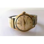 A Smiths Imperial 9ct gold (stamped) cased wristwatch with Arabic/baton dial, central seconds