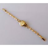 A ladies 9ct gold Avia cocktail watch with fancy-link bracelet, baton markers, Swiss hallmarks, 10.