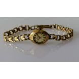 A mid-century 9ct gold-cased ladies dress watch by Regency with gold strap, hallmarked, not in