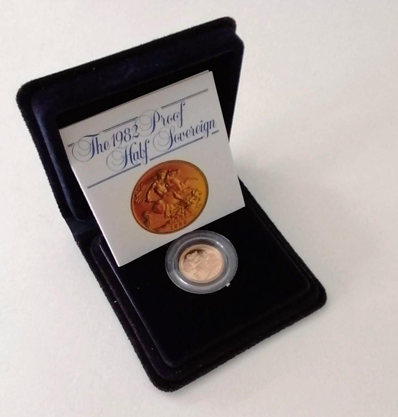 A Royal Mint cased proof gold half sovereign, dated 1982