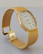 A Rolex Geneve Cellini ladies wristwatch, the signed brushed gold dial and bark effect bracelet,