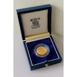 A cased gold half-sovereign in capsule, 1988