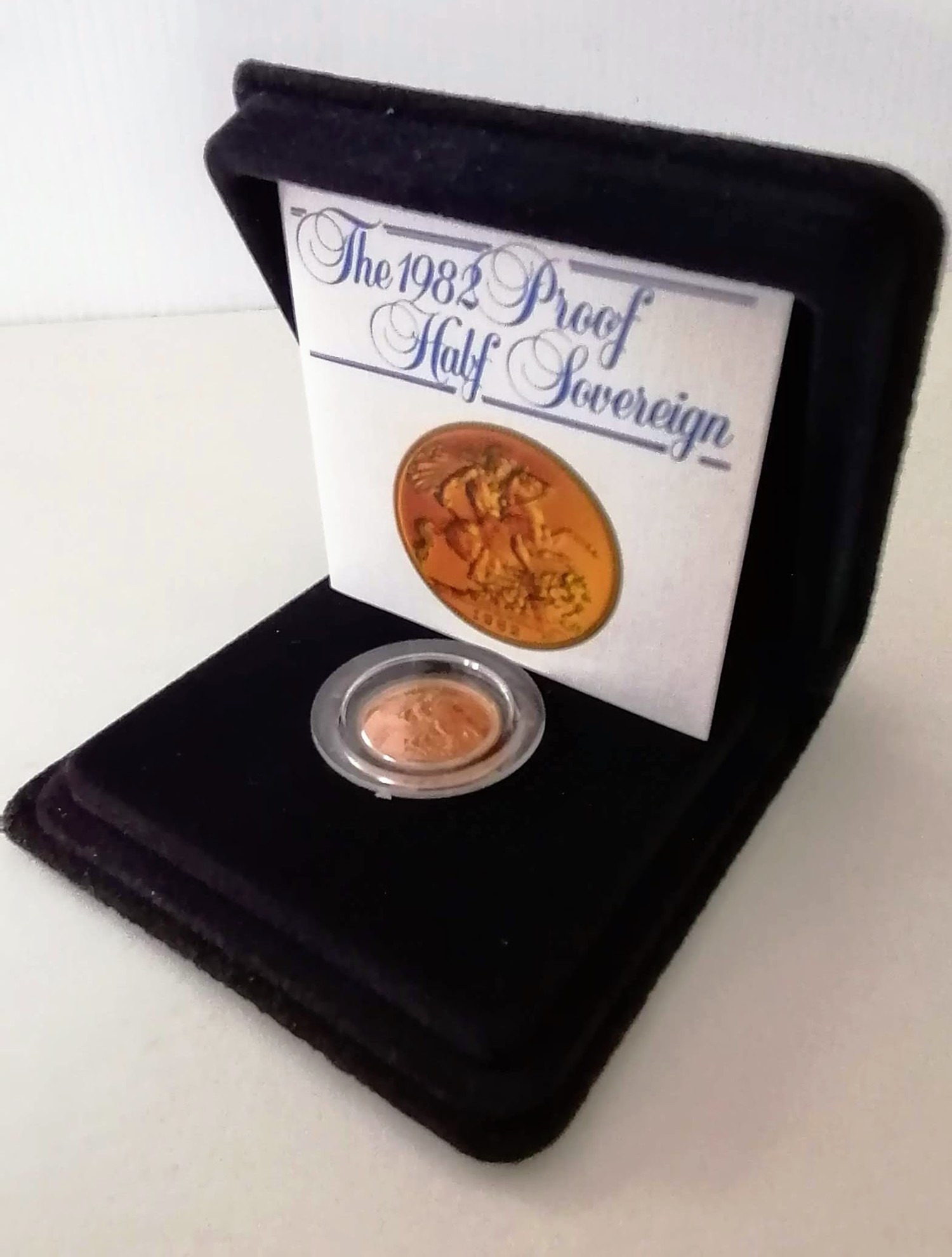 A Royal Mint cased proof gold half sovereign, dated 1982