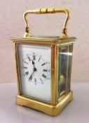 A late 19th century larger brass carriage clock with Roman numerals, twin train movement striking on