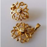 A gold filigree brooch, 20mm diam. and matching pendant, 17mm diam. set with diamond decoration,