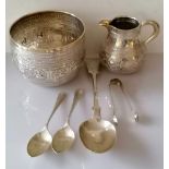 A Victorian Anglo-Indian silver embossed bowl (8.5 h x 11 cm diameter) and creamer (8.5 cm H) by