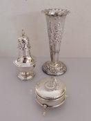 A late Victorian weighted silver vase with shaped rim and embossed floral design by Elkington & Co