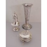 A late Victorian weighted silver vase with shaped rim and embossed floral design by Elkington & Co