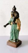 Franz Xaver Bergmann (1861-1936), a bronze figurine of a man with a child on shoulders on a square