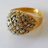 A white and yellow gold dress ring with woven pattern, size O, stamped 750, 5.64g