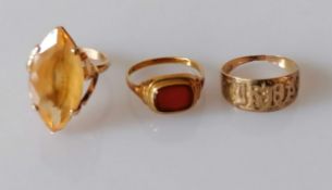 A gold marquise-cut citrine ring, unmarked, tests for 18ct, 5.19g; a gem-set signet ring, stamped