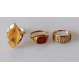 A gold marquise-cut citrine ring, unmarked, tests for 18ct, 5.19g; a gem-set signet ring, stamped