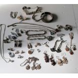 Two silver bangles, tennis bracelets, earrings, chains, rings, pendants, etc, all stamped 925, 261g