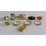 A selection of eight gold gem-set rings, a lock, all hallmarked 9ct, another ring not stamped,