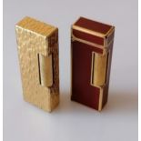 A gold plated textured Dunhill Rollagas lighter, and another with red lacquer, both patent 24163 and