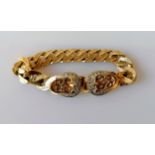 A 9ct yellow gold flat curb-link textured and carved design buckle bracelet, 19 cm, hallmarked, 47g