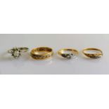 A white gold star-ring with diamond decoration; a white and yellow gold eternity ring; a gold and