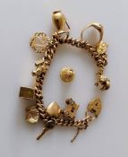 A gold charm bracelet, each link and charm hallmarked 9ct, 19 cm, 58.5g