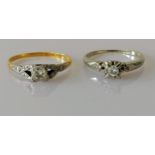 An early 20th century yellow gold and platinum diamond solitaire ring, round-cut diamond