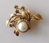 A Givenchy Moonlight and Roses brooch, 50mm x 40mm, in 14ct gold set with diamonds, rubies and a