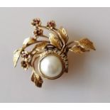 A Givenchy Moonlight and Roses brooch, 50mm x 40mm, in 14ct gold set with diamonds, rubies and a