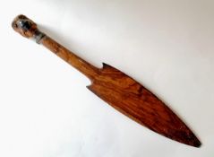 A wooden tribal spearhead with sculpted terminal, 46 cm