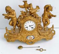 A 19th century French porcelain and ormolu mantel clock, the striking movement by Japy stamped