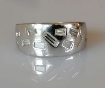 A mid-century platinum and diamond ring with tapering shank, irregular baguette diamonds, size O,